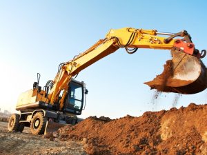 "Excavator safety features in action while excavating soil on a construction site in Australia.