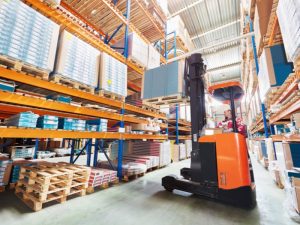 Overloading forklift contributing to forklift accidents in the workplace, highlighting a key safety concern.