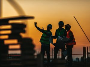 Image of workers receiving site inductions to understand safety protocols on a construction site.